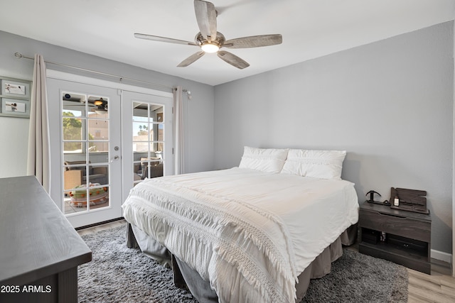 bedroom with baseboards, a ceiling fan, wood finished floors, french doors, and access to exterior