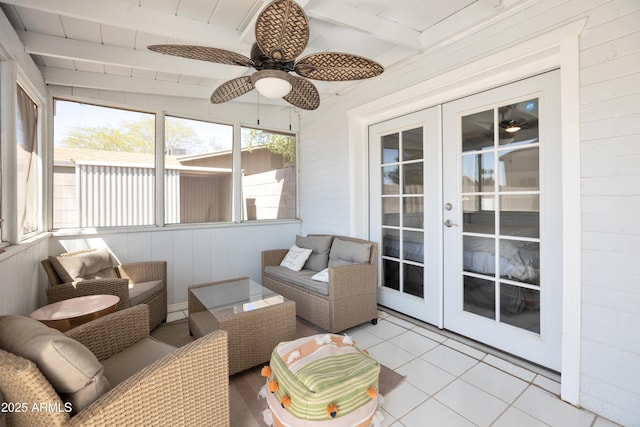 sunroom / solarium with french doors, a ceiling fan, and a healthy amount of sunlight