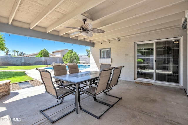 view of patio / terrace with a fenced backyard, a ceiling fan, a fenced in pool, and outdoor dining area