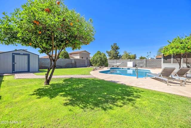 view of pool with a yard, a storage shed, and a fenced backyard
