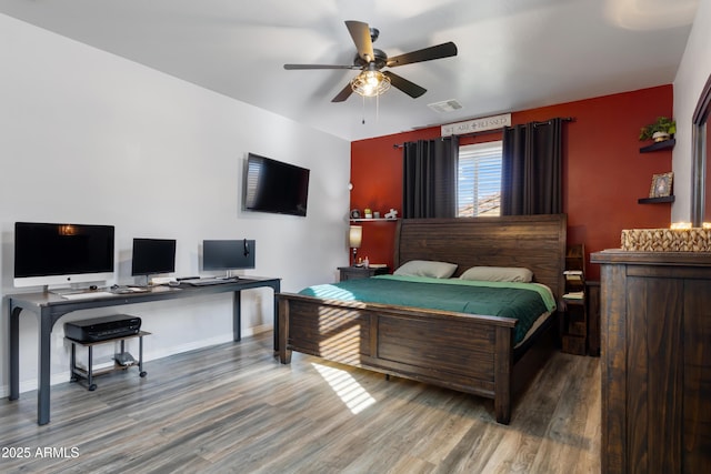 7305 W Darrel Rd, Laveen, AZ 85339 - bedroom featuring wood finished floors, an office area, and baseboards