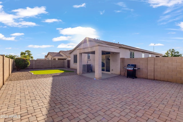 7305 W Darrel Rd, Laveen, AZ 85339 - rear view of house featuring stucco siding, a patio, a fenced backyard, and cooling unit