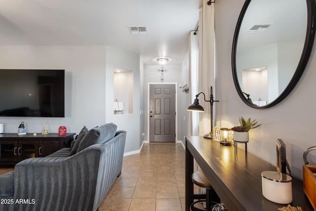 7305 W Darrel Rd, Laveen, AZ 85339 - living room featuring light tile patterned floors and baseboards