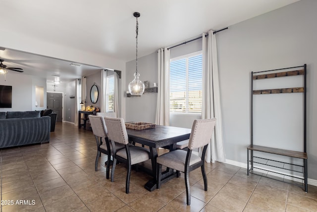 7305 W Darrel Rd, Laveen, AZ 85339 - tiled dining room with ceiling fan and baseboards