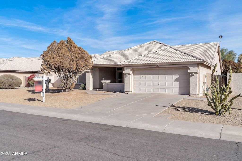 ranch-style home with a garage