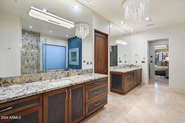 bathroom featuring vanity and a chandelier