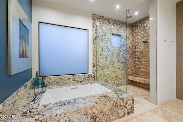 bathroom with tile patterned flooring and plus walk in shower