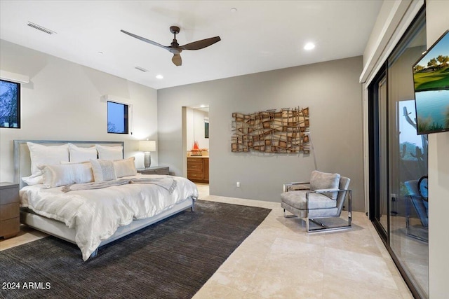 tiled bedroom with access to outside, ensuite bathroom, and ceiling fan