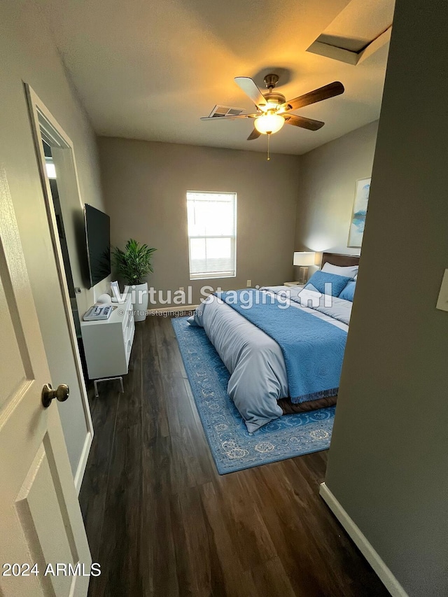 bedroom featuring ceiling fan and dark hardwood / wood-style flooring