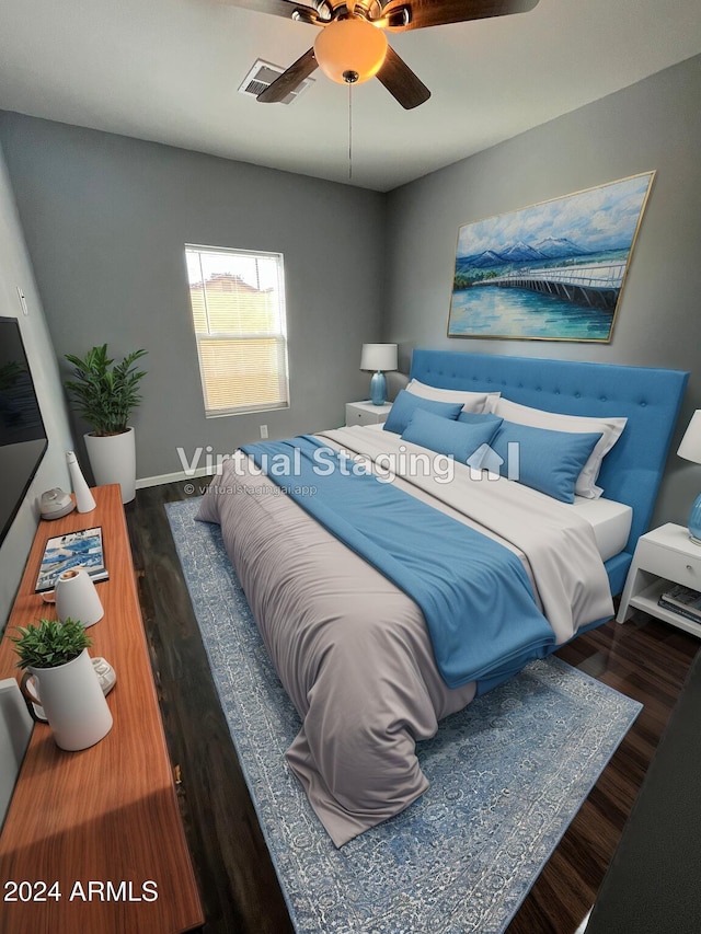 bedroom with ceiling fan and dark wood-type flooring