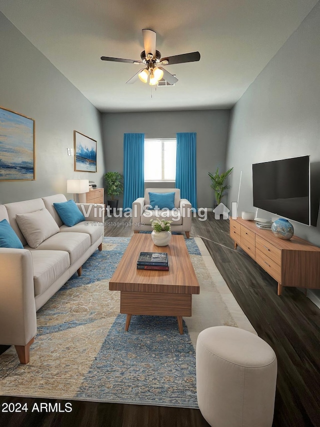 living room with ceiling fan and dark wood-type flooring