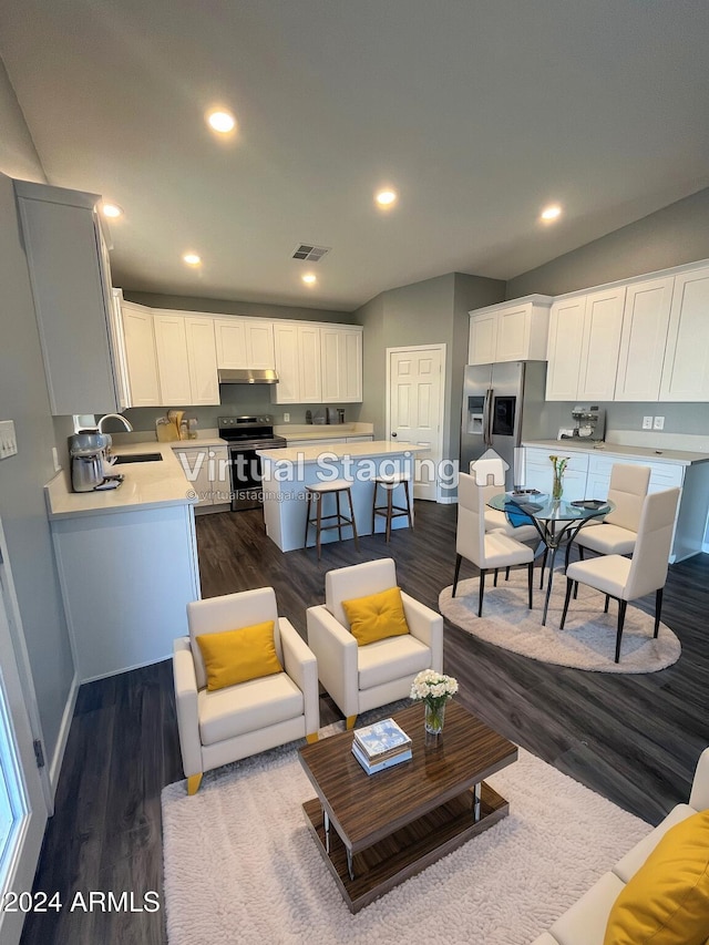 living room featuring sink and dark hardwood / wood-style floors