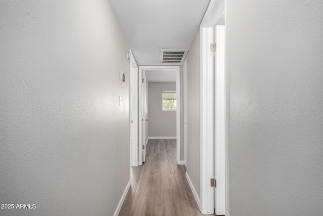 hallway featuring light wood-type flooring