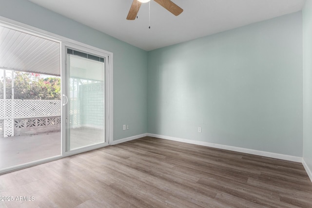 empty room featuring ceiling fan and wood-type flooring