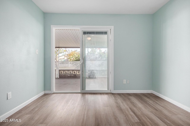 unfurnished room featuring light wood-type flooring