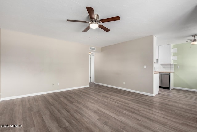 unfurnished living room featuring ceiling fan and dark hardwood / wood-style flooring