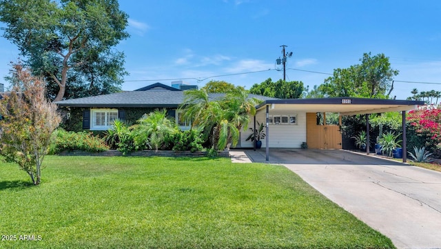 3351 N 6th Ave, Phoenix, AZ 85013 - view of front of home with concrete driveway, a front yard, and an attached carport