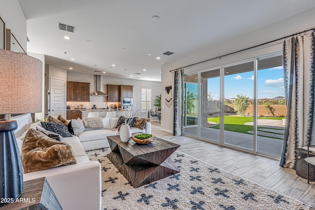 17831 W Mission Ln, Waddell, AZ 85355 - living area with light wood-type flooring, recessed lighting, and visible vents