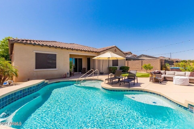 view of swimming pool featuring a patio area and an outdoor living space