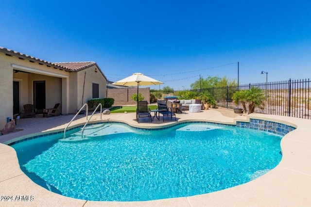 view of pool featuring a patio area