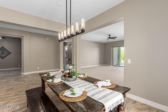 dining area with carpet floors and ceiling fan