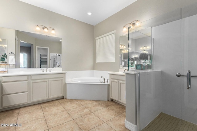 bathroom featuring vanity, plus walk in shower, and tile patterned floors