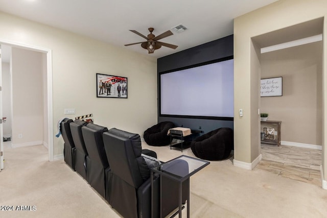 cinema featuring ceiling fan and carpet