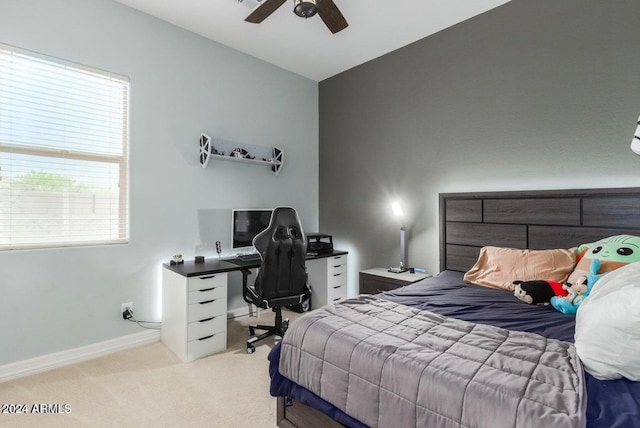 bedroom featuring ceiling fan, lofted ceiling, and light colored carpet