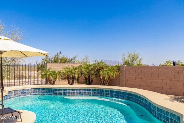 view of pool featuring pool water feature