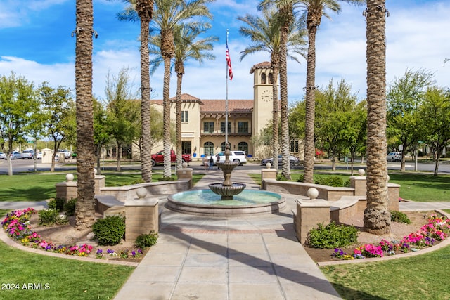 view of home's community with a lawn