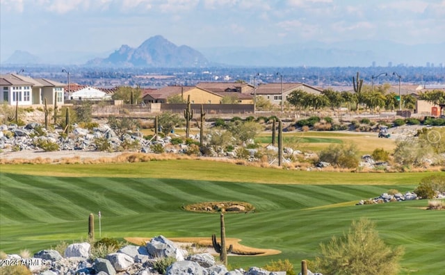 view of community featuring a yard and a mountain view