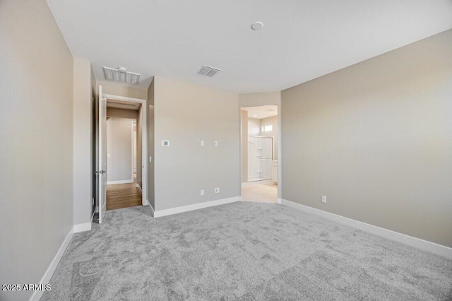 unfurnished bedroom featuring baseboards, visible vents, and carpet flooring