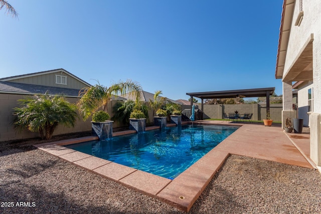view of pool with pool water feature and a patio