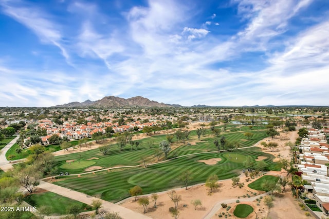 drone / aerial view with view of golf course and a mountain view