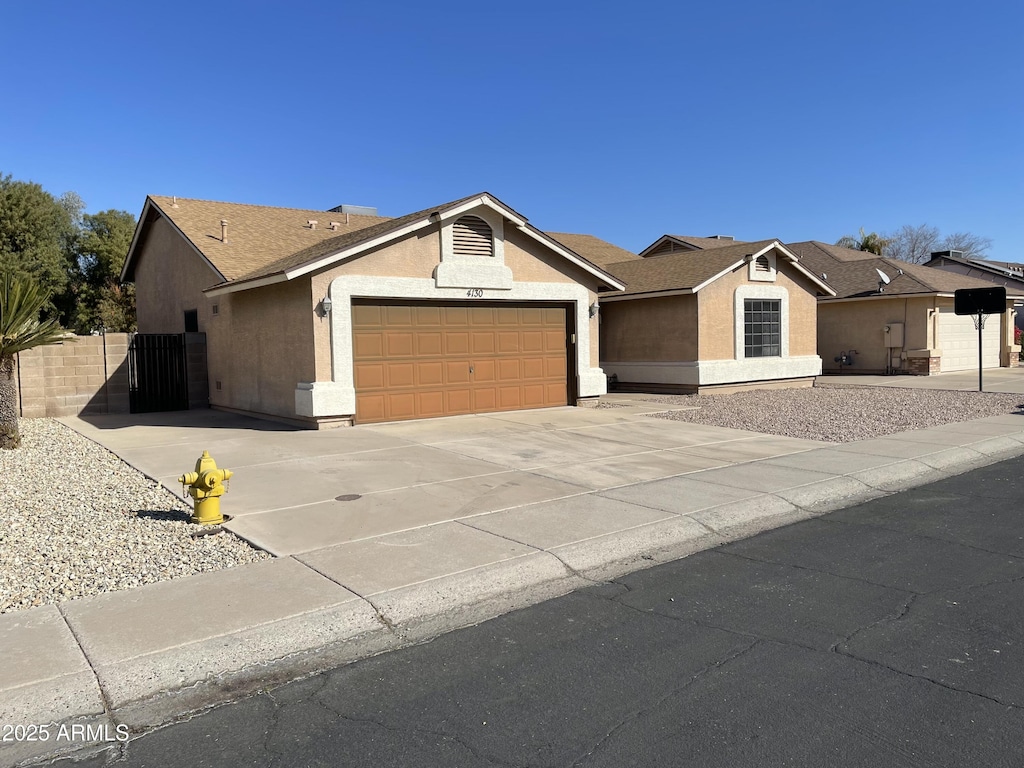 single story home featuring a garage