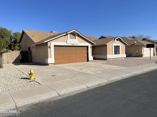 single story home featuring a garage