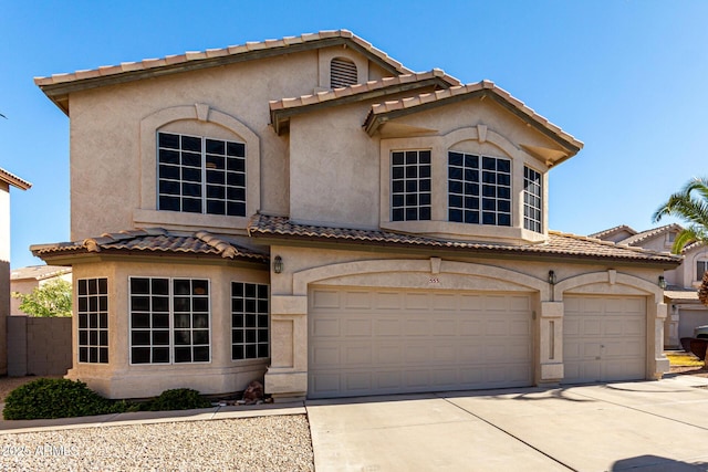 mediterranean / spanish-style house featuring a garage