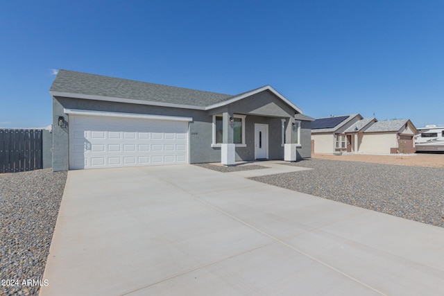 single story home featuring a garage