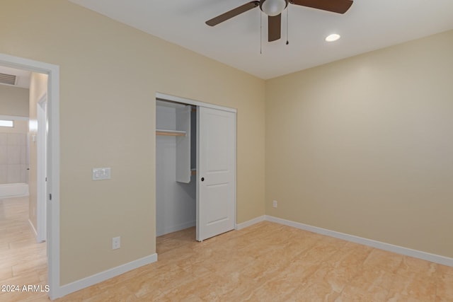 unfurnished bedroom with ceiling fan and a closet