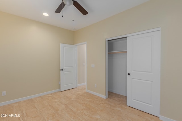 unfurnished bedroom featuring ceiling fan and a closet