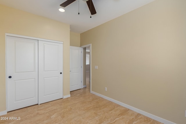 unfurnished bedroom featuring a closet and ceiling fan