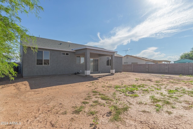 back of house with a patio area