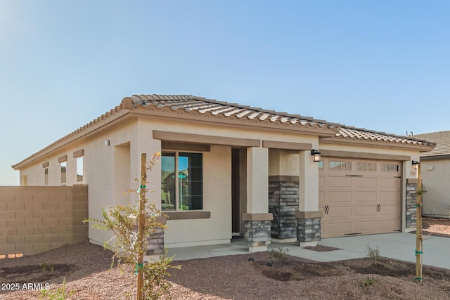 view of front of home with a garage