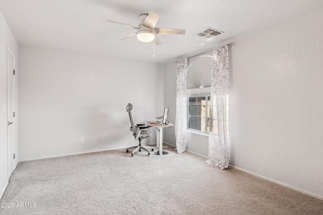 interior space with a ceiling fan, baseboards, visible vents, and carpet flooring