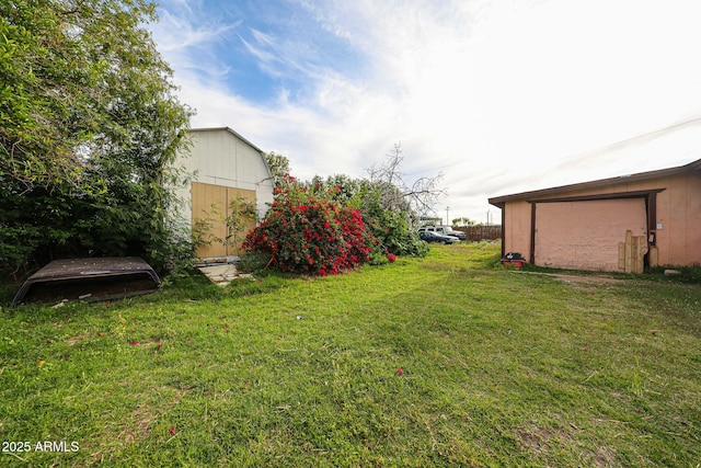 5239 W Maryland Ave, Glendale, AZ 85301 - view of green lawn featuring a storage shed and an outdoor structure