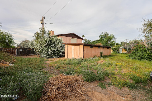 5239 W Maryland Ave, Glendale, AZ 85301 - view of yard with a storage unit, fence, and an outdoor structure
