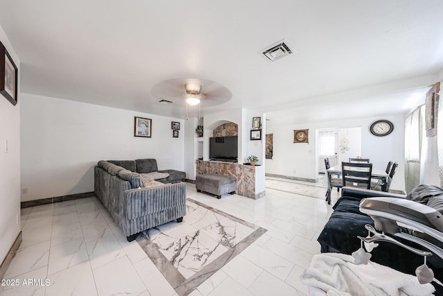 5239 W Maryland Ave, Glendale, AZ 85301 - living area with light marble finish flooring, ceiling fan, and baseboards