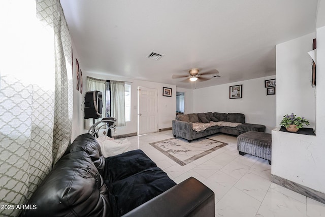 5239 W Maryland Ave, Glendale, AZ 85301 - living room with ceiling fan, light marble finish flooring, and baseboards