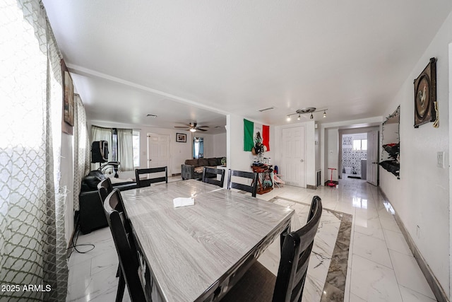 5239 W Maryland Ave, Glendale, AZ 85301 - dining room featuring light marble finish floors, healthy amount of natural light, and baseboards