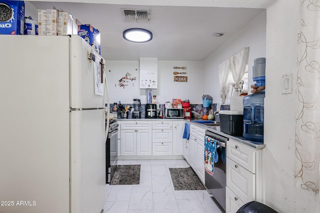5239 W Maryland Ave, Glendale, AZ 85301 - kitchen with stainless steel appliances, light marble finish floors, and white cabinets